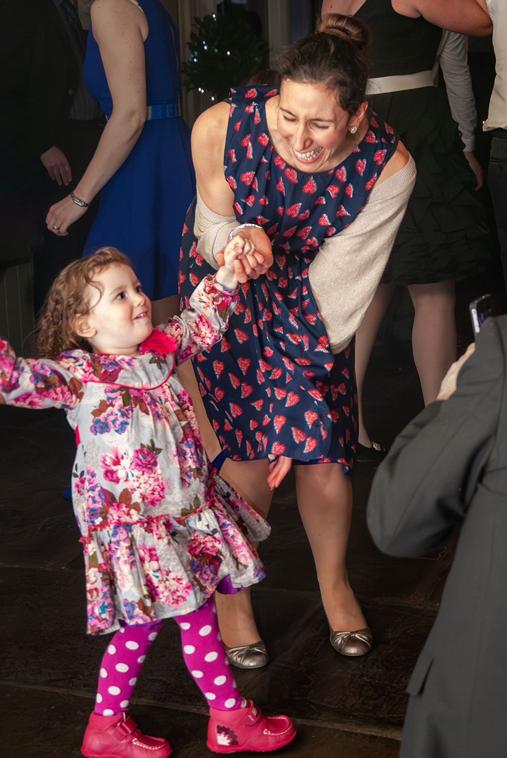 Child and mother having fun at a party